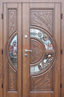 Уличная дверь в цвете Итальянский орех с виноритом и ковкой со стеклом ДВТ-147 в Архангельске